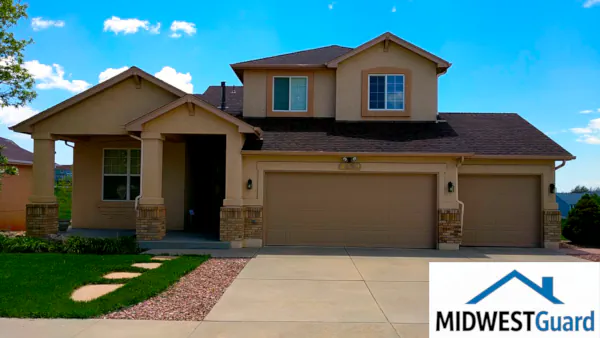 Insurance-approved hail damage restoration in Springdale, AR featuring a full GAF roof replacement, siding repair, and new seamless gutters by MIDWESTGuard.